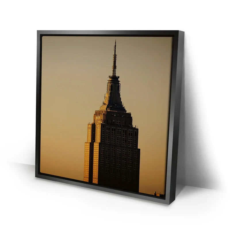 Vertical View Of The Top Of The Empire State Building At Sunrise